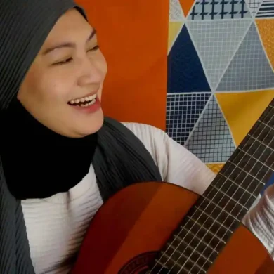 Malay musician singer playing guitar
