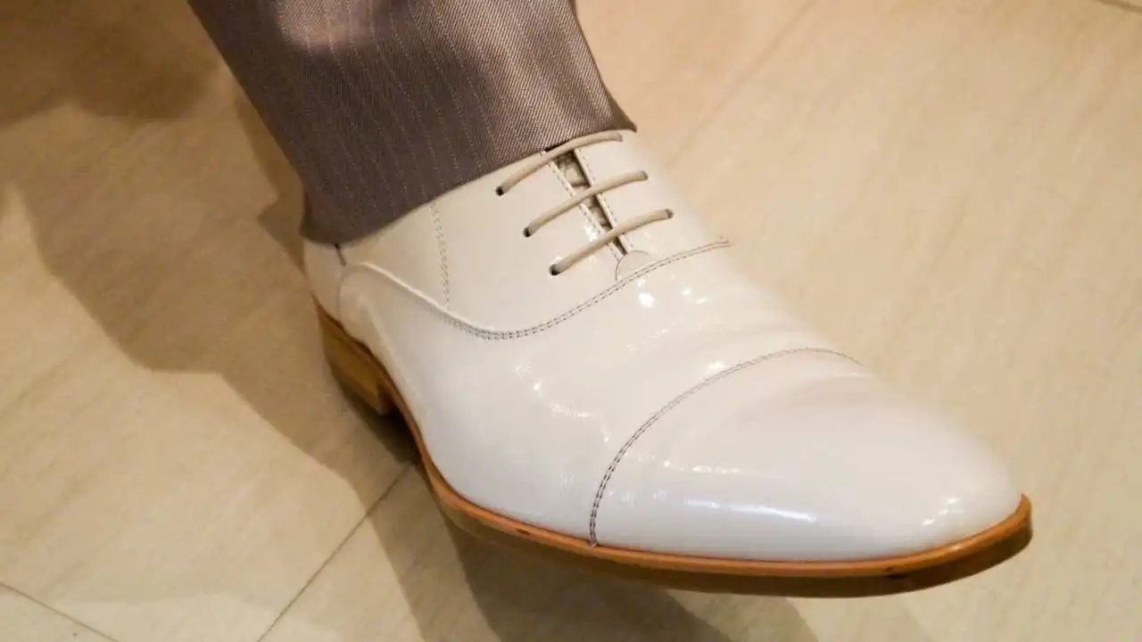 shiny white shoes for groom